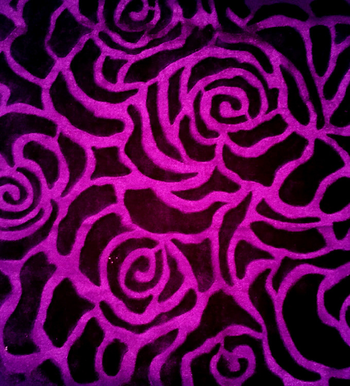 embossed velvet fabric in pink and black flower print